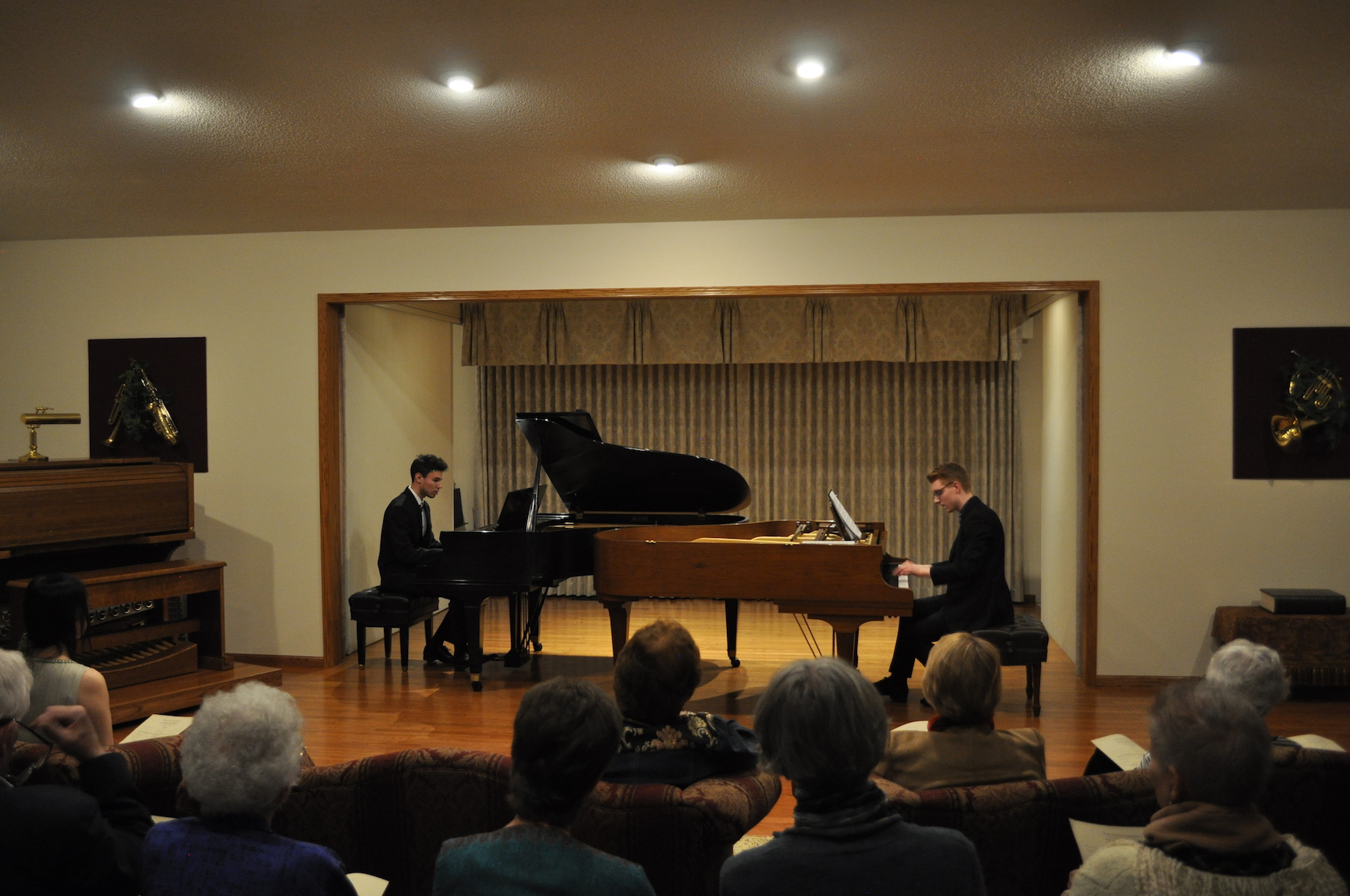 Two men playing piano