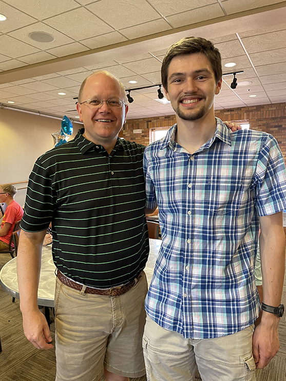 Russ Kramer poses with his former student Sam Swegel