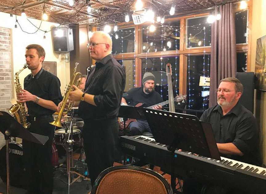 Russ Kramer poses with his jazz band Five Spot