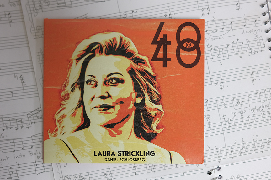 Orange and gold illustrated person on a music album cover