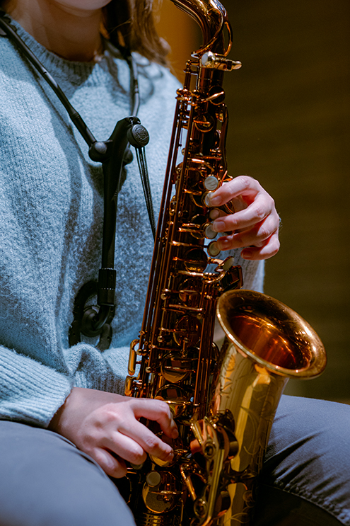 Lydia Linch plays the saxophone