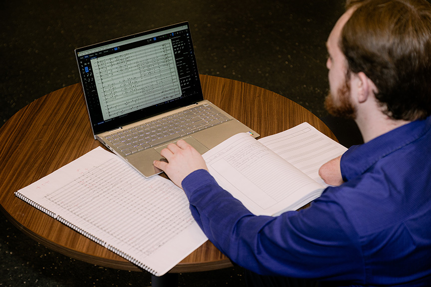 Jarod Hart composes music with his computer.