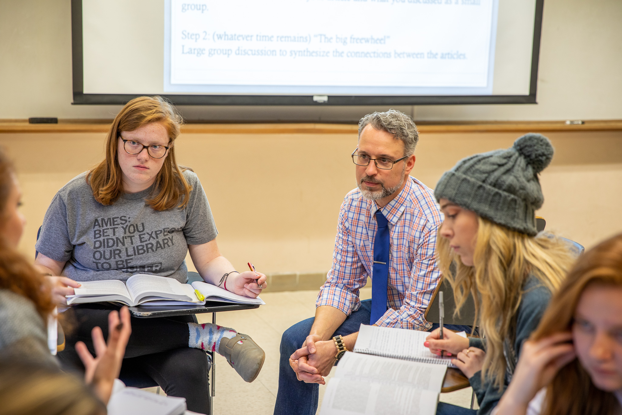 Assistant teaching professor Michael Goebel and students in WGS 430