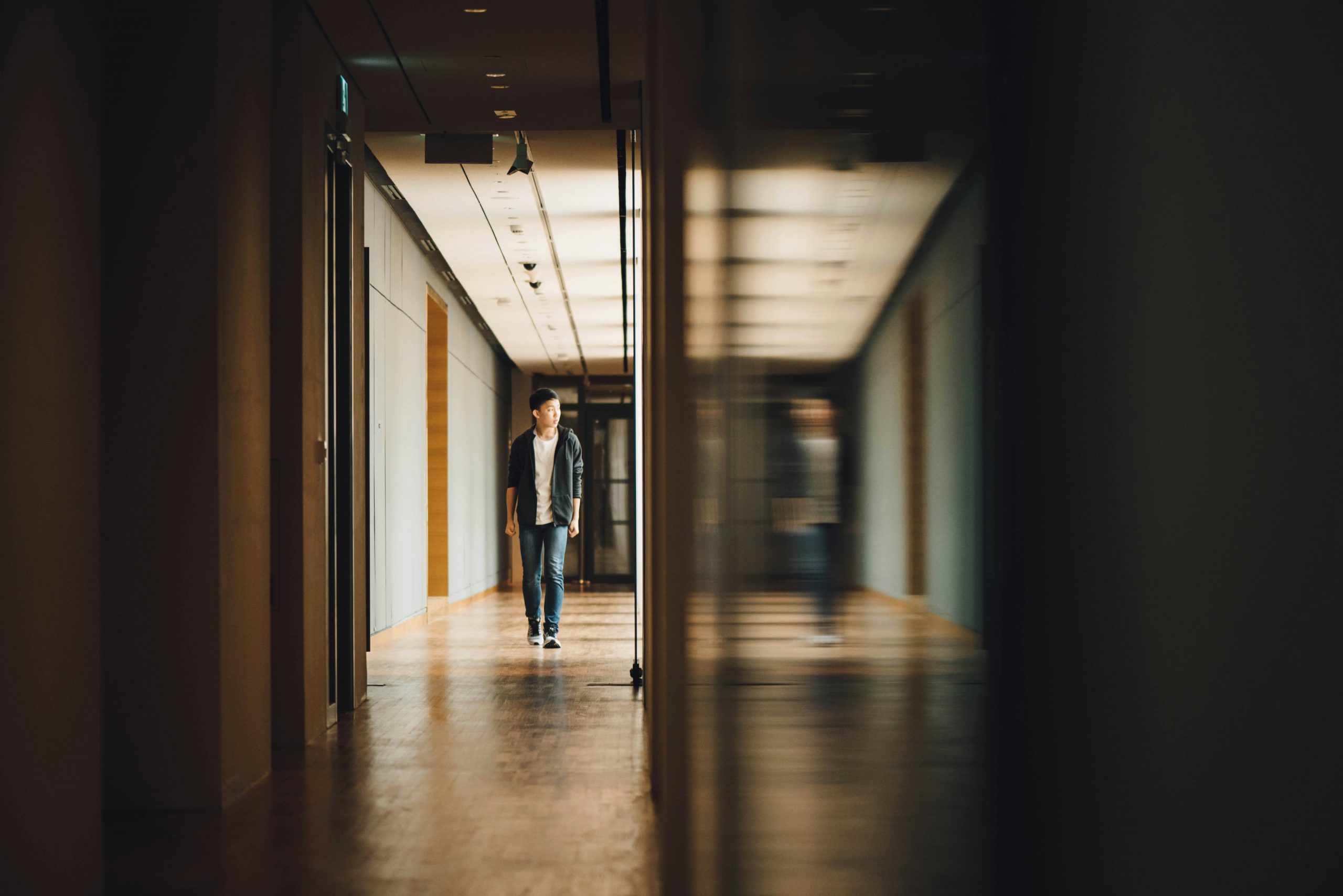 Student walking through school hallway