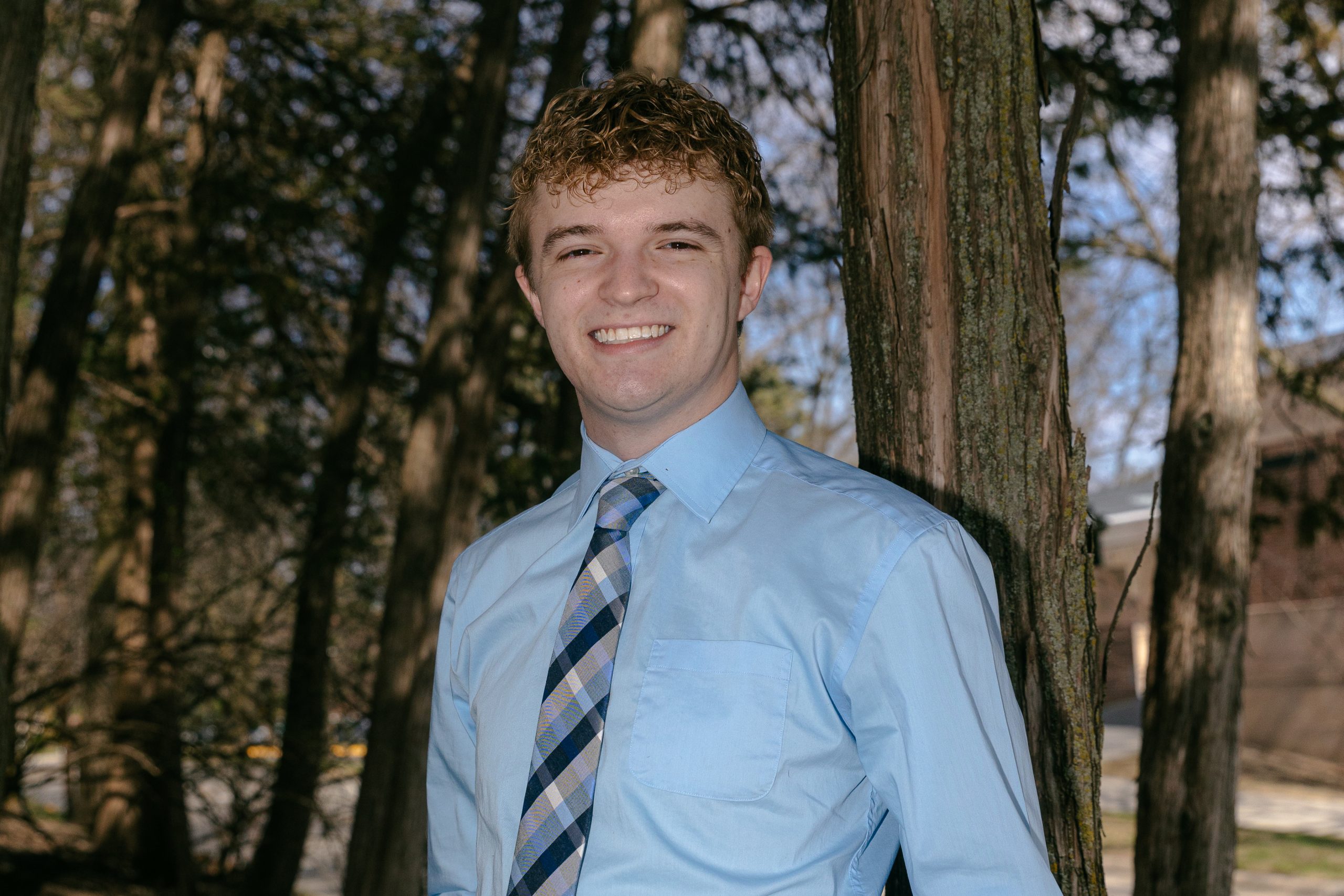 Kanyon Huntington standing by a tree.