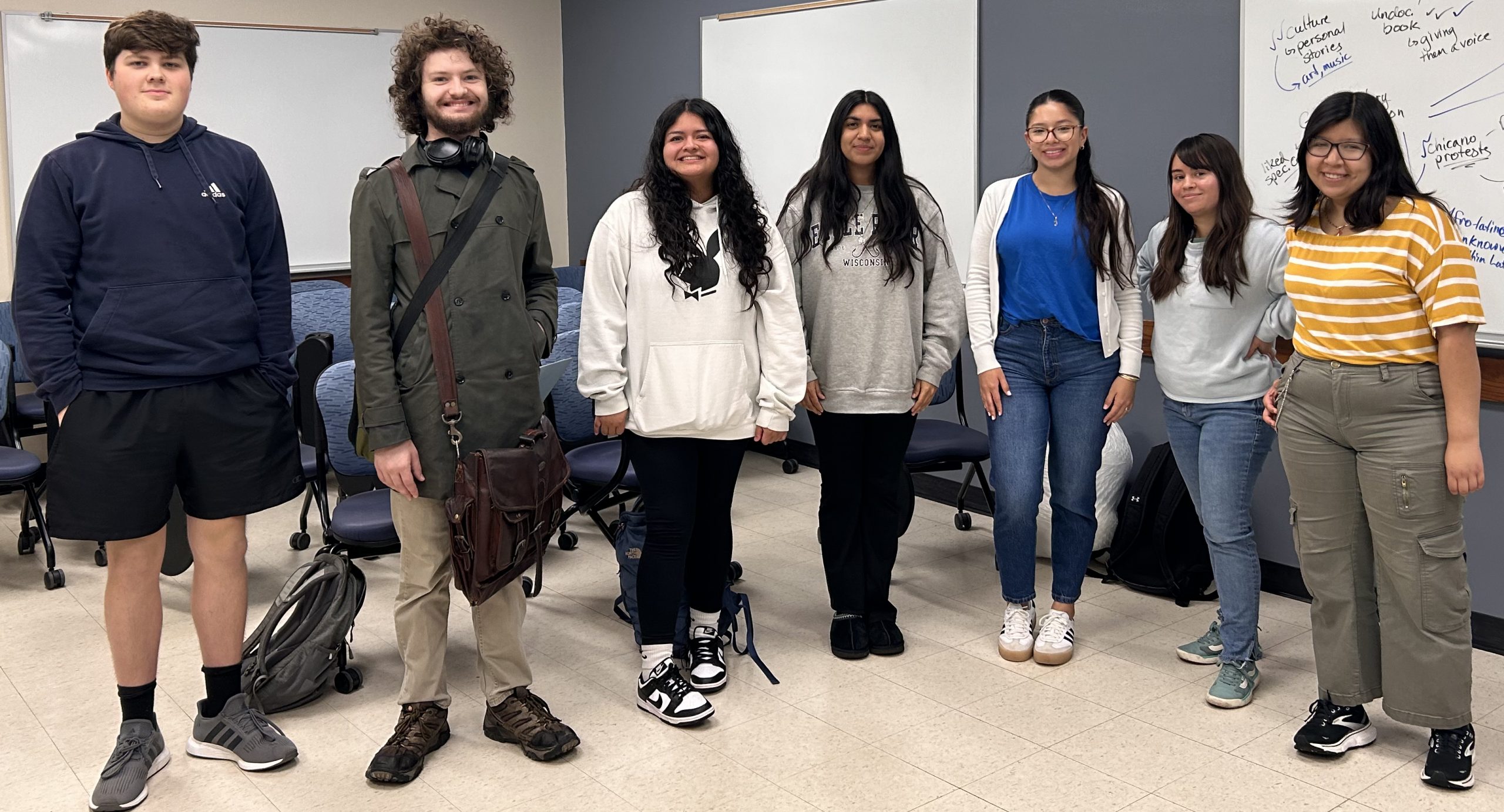Group of students posing casually and smiling